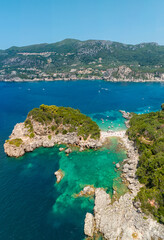 Naklejka premium Aerial view of Limni Beach Glyko, on the island of Corfu. Greece. Where the two beaches are connected to the mainland providing a wonderful scenery. Unique double beach. Kerkyra