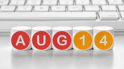 Letter dice in front of a keyboard - August 14