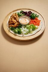 Fresh ingredients for preparing tortilla with vegetables, grilled chicken and sauce