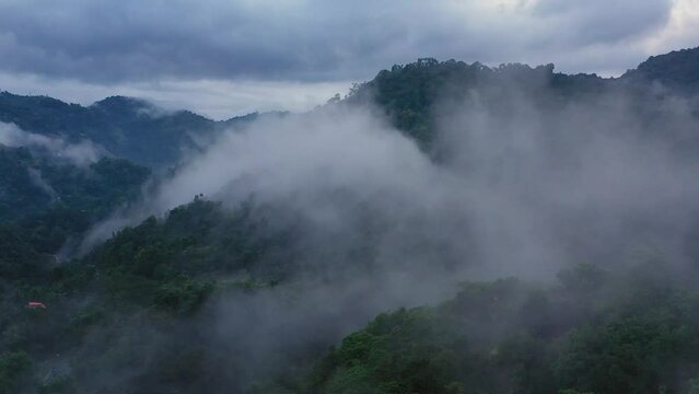Aerial drone of mountains and hills through fog and clouds. Sri Lanka.