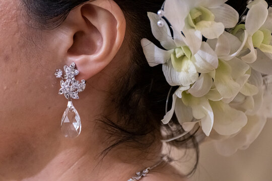 Close-up of the bride's earrings coming up for the wedding