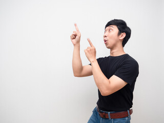 Young man gesture point finger feels excited copy space isolated