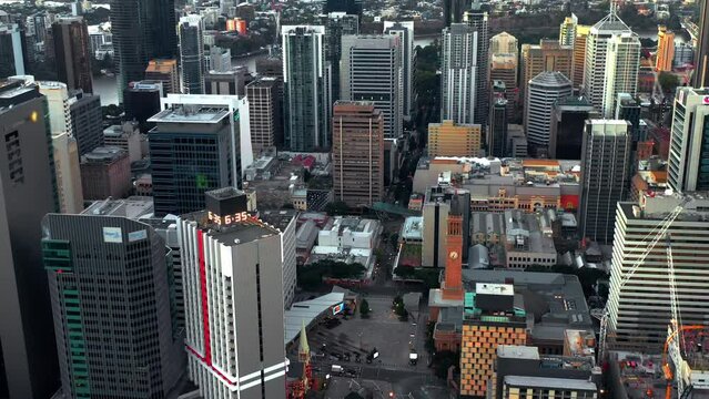 Fly Over King George Square Park With City Hall Clock Tower In Brisbane CBD, Queensland Australia. Aerial Drone Shot