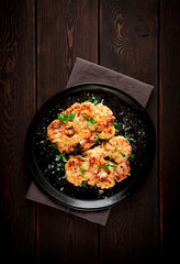 Steak, cauliflower , with cheese , spices, homemade, on a wooden table, dark background, close-up, top view, selective focus, no people,