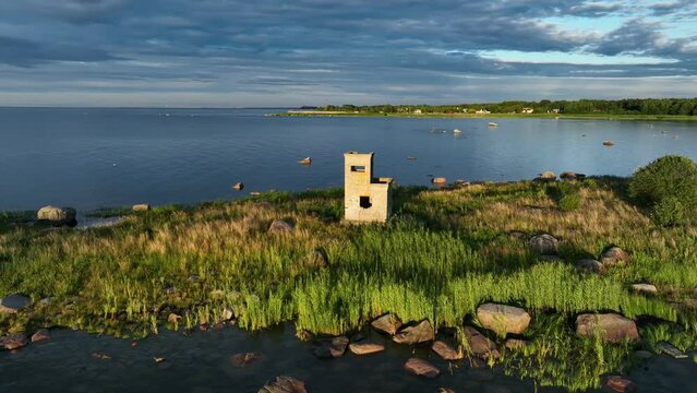 Aerial footage of building that was a border guard post during the Soviet occupation in Estonia. It is now a reminder of that era. Leppneeme, Estonia.