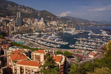 Panoramic aerial view of Monaco and Port Hercule, sweeping views of the city, mountains and harbor, luxury yachts and apartments in La Condamine district, city centre Monte Carlo, Monaco,Cote d'Azur