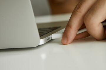 connecting cable to laptop close-up
