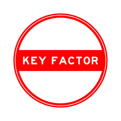 Red color round seal sticker in word key factor on white background