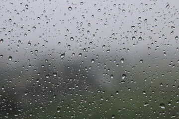 Raindrops on the window and rainy day in Ho Chi Minh City (Saigon), Vietnam