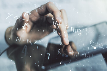 Creative scientific formula illustration with finger presses on a digital tablet on background, science and research concept. Multiexposure