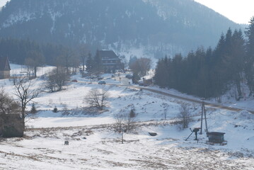 views in the mountains in winter, buildings visible, Góry Suche, Poland