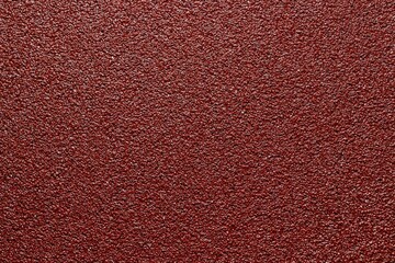 Fototapeta premium sandpaper red color close up background texture