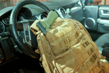 handgun in military rucksack