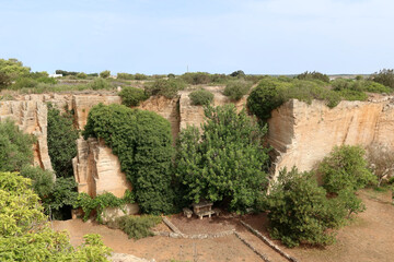 Fototapeta premium Lithica, Pedreres de s'Hostal, Menorca (Minorca) island, Spain. The sandstone quarries overgrown by trees and vegetation with labirynths and gardens