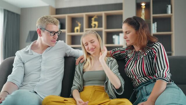 Worried Mom And Dad Comforting Depressed Teen Daughter Bonding At Home. Fam Loving Understanding And Supporting Sad Teenage Girl Having Psychological Puberty Problem Concept.