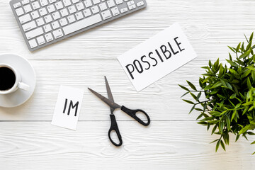 Impossible is possible - word on card. Challenge and motivation concept