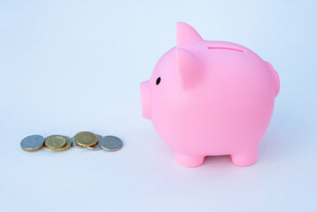 Piggy bank on the table. Money saving concept.