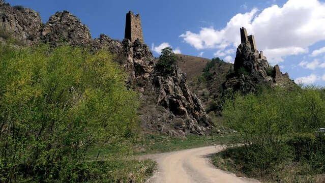 Driving plate of car moves on road to Ingush defense watchtowers Vovnushki in north Caucasus, Russia