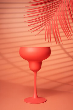 Cocktail glass on a pink background. - Summer concept.