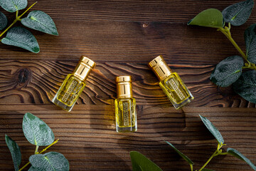 Fototapeta na wymiar Glass bottles of perfume essential oil. Top view