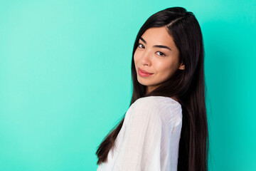Fototapeta premium Profile portrait of lovely cute young person long black hairdo empty space isolated on bright teal color background
