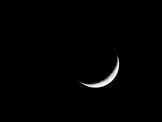 Fototapeta na wymiar Crescent Moon Isolated in Black Night Sky