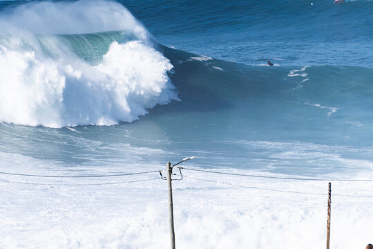 View of surfers, as they ride the waves, Estremadura, Nazar&egrave;, Portugal.