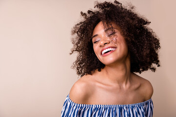 Portrait of adorable cute lady closed eyes beaming smile have good mood isolated on beige color...