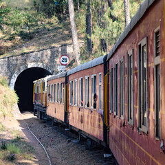 Toy Train moving on mountain slopes, beautiful view, one side mountain, one side valley moving on...