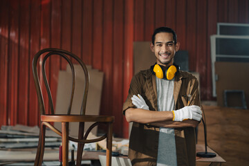 Portrait Young Asian man Carpenter in carpentry workshop
