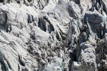 Fototapeta na wymiar Close-up view of White and black Minapin glacier and Rakaposhi mountain view, Karakoram, Pakistan. Texture and pattern, background