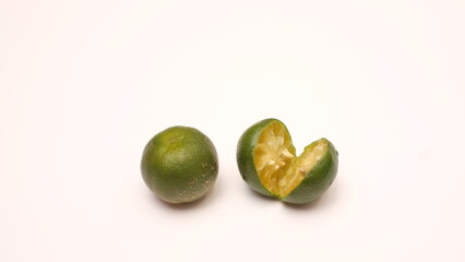 Halved lime isolated on white background