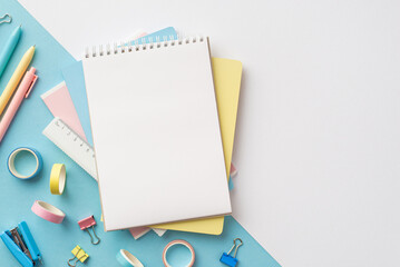 Back to school concept. Top view photo of stack of notebooks pens ruler stapler binder clips and...