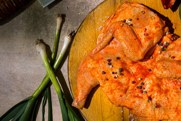 Raw marinated tobacco chicken carcass