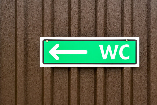 Green sign of public toilets WC