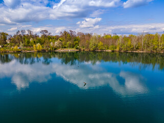 Blue lake in the forest reflection