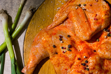 Raw marinated tobacco chicken carcass