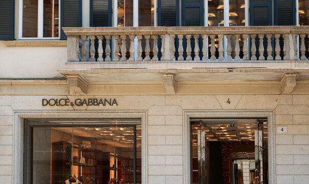 The logo sign of Dolce and Gabbana premium luxury clothing and accessories company on the streets of fashion city Milan. Italy, 2022.