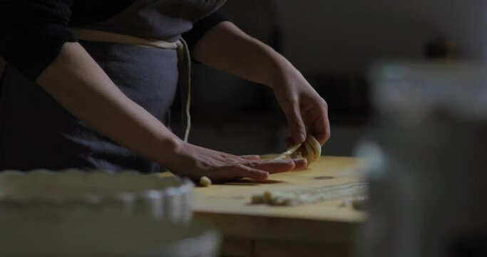 Making pasta. Cooking in a typical italian kitchen. Pici