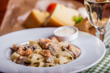 Pasta with meat, champignon, cheese