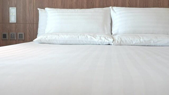 Hotel room bed panning shot