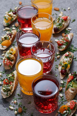 Summer drinks and toasts with fruits on a gray table. Healthy food, dietary snack, vegetarian snacks.