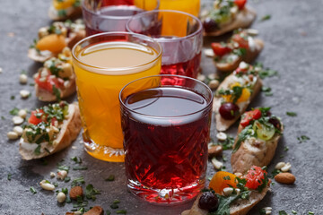 Summer drinks and toasts with fruits on a gray table. Healthy food, dietary snack, vegetarian snacks.