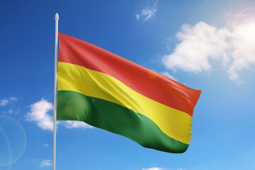 Flag of Bolivia on blue sky. 3d illustration.