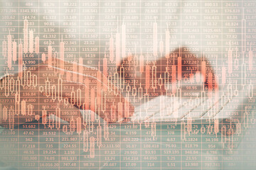 Double exposure of graph with man typing on computer in office on background. Concept of hard work.