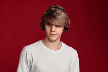 man in casual white t-shirt with modern headphones