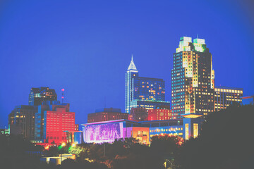 Obraz premium A night skyline of Raleigh, North Carolina downtown in a cinematic look.
