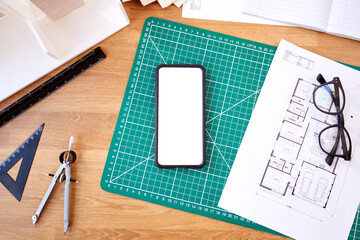 Overhead Shot Of Desk In Architects Office With Plans Drawing Instruments And Mobile Phone