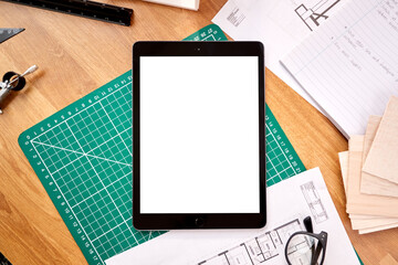 Overhead Shot Of Desk In Architects Office With Plans Drawing Instruments And Digital Tablet