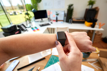 POV Shot Of Female Architect Working In Office Using Smart Watch - obrazy, fototapety, plakaty